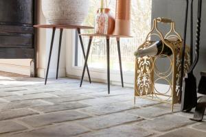 a room with two tables with vases and shoes on them at Unieke landelijke woning met zwembad in Kranenburg +59 photos