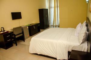 Postel nebo postele na pokoji v ubytování Fabian Hotel Ado-Ekiti + 4 fotografie