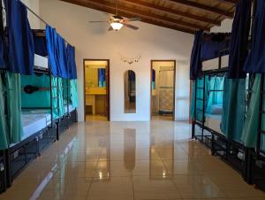 a room with two bunk beds and a ceiling at Hostal Azul in Granada