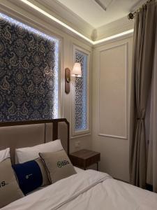 Posteľ alebo postele v izbe v ubytovaní Oasis Inn Budapest