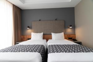 Postel nebo postele na pokoji v ubytování Amante Narikala Boutique Hotel