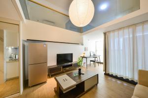 Televisor o centre d'entreteniment de Dabaizhijia Executive Apartment Bantian Huawei Branch
