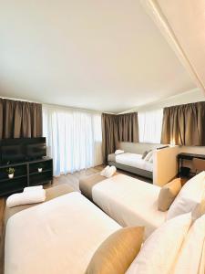 Postel nebo postele na pokoji v ubytování Paradise Rooms