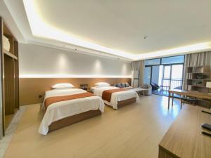 Rúm í herbergi á Chongqing Xiaoshe Yuanmu River View Guesthouse Jiefangbei Hongyadong Branch