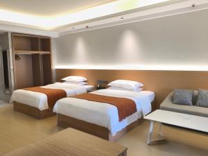 Rúm í herbergi á Chongqing Xiaoshe Yuanmu River View Guesthouse Jiefangbei Hongyadong Branch