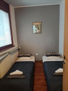 Posteľ alebo postele v izbe v ubytovaní Cleopatra Apartment Budapest