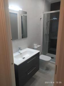 a bathroom with a sink and a toilet at BAJAMAR II 22 MENYBER in Nerja +14 photos