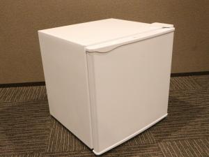 a white refrigerator sitting on top of a floor at Hotel LiVEMAX Shiodome in Tokyo
