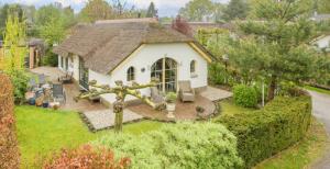 an aerial view of a house with a roof at Royal Veluwe in Putten