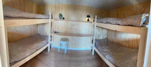 an overhead view of a room with two bunk beds at Hærvejshallen Hytte 1 in Bække