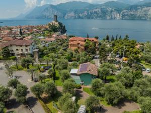 an aerial view of a small town next to the water at Casa Titi in Malcesine