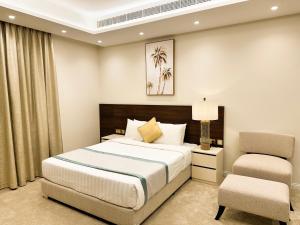 Postel nebo postele na pokoji v ubytování Hotel Majestic Inn - Madinat Khalifa + 12 fotografií