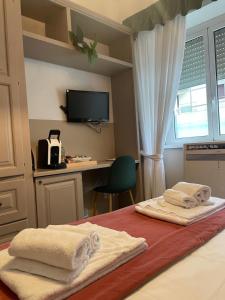 Letto o letti in una camera di Next Stop Vatican Guest House