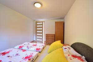 Posteľ alebo postele v izbe v ubytovaní Apartament Na Górskiej