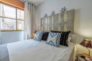 Postel nebo postele na pokoji v ubytování Apartamento con Parking El Patio de La Muralla