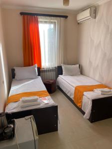 Voodi või voodid majutusasutuse Zangu Hotel toas