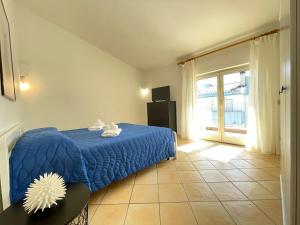 Posteľ alebo postele v izbe v ubytovaní Residence Ponente