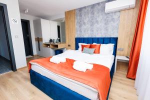 Postel nebo postele na pokoji v ubytování Boulevard Hotel