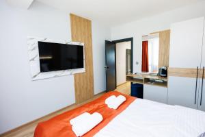 TV a/nebo společenská místnost v ubytování Boulevard Hotel
