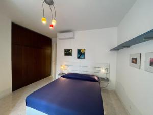 Ένα ή περισσότερα κρεβάτια σε δωμάτιο στο Santis 1