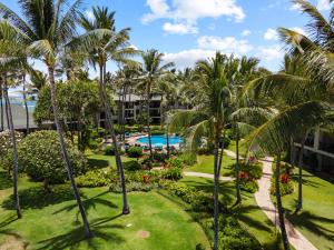 an aerial view of a resort with a pool and palm trees at Turtle Bay Villas 307 in Kahuku