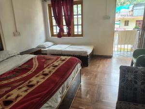 Postel nebo postele na pokoji v ubytování Sandeep homestay + 6 fotografií