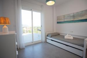 En eller flere senge i et værelse på AT Tramuntana