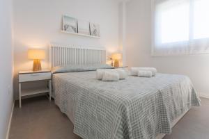 En eller flere senge i et værelse på AT Tramuntana