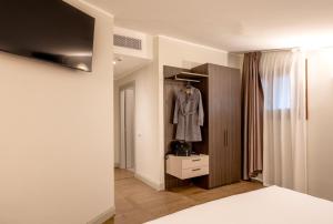Letto o letti in una camera di Hotel Carlton