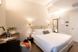 Letto o letti in una camera di Hotel Carlton