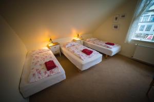 Ένα ή περισσότερα κρεβάτια σε δωμάτιο στο Guesthouse Gamla