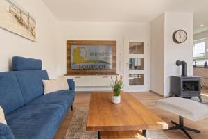 TV a/nebo společenská místnost v ubytování Ferienhaus Lüttje Steern 5 Sterne