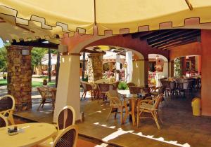 En restaurang eller annat matställe på Villaggio Camping Spiaggia Del Riso