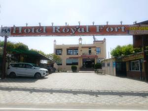 a hotel royal forum sign in front of a building at Hotel Royal Fort in Gurgaon