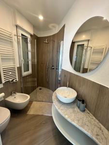 a bathroom with two sinks and a large mirror at L'Íle D'Azur in Arenzano +38 photos