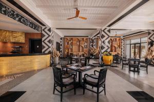 a dining room with a table and chairs at JAZ Sharm Dreams in Sharm El Sheikh