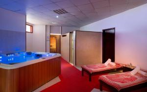 a large bathroom with a tub and a shower at JAZ Sharm Dreams in Sharm El Sheikh