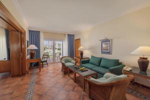 a living room with a couch and a table at JAZ Sharm Dreams in Sharm El Sheikh