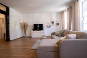 Μια τηλεόραση ή/και κέντρο ψυχαγωγίας στο Ferienwohnung Neue Markstraße