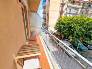 een bank op het balkon van een gebouw bij Holy Dove by Wonderful Italy in Cefalù