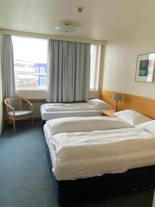 Voodi või voodid majutusasutuse Hotel Isafjördur - Torg toas