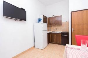 Kuchyň nebo kuchyňský kout v ubytování Apartments Marko