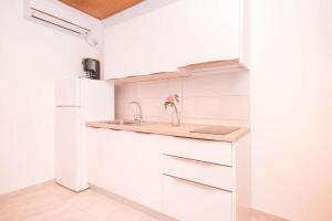 Kuchyň nebo kuchyňský kout v ubytování Apartments Marko