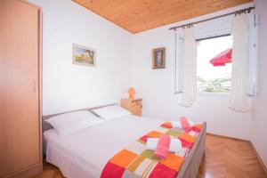Postel nebo postele na pokoji v ubytování Apartments Marko