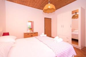 Postel nebo postele na pokoji v ubytování Apartments Marko