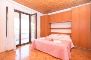 Postel nebo postele na pokoji v ubytování Apartments Marko