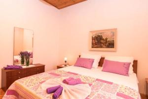 Postel nebo postele na pokoji v ubytování Apartments Marko