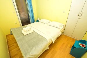 Łóżko lub łóżka w pokoju w obiekcie Apartment Neno