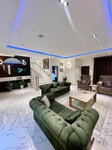 a large living room with a couch and a table at Allan's place in Abuja