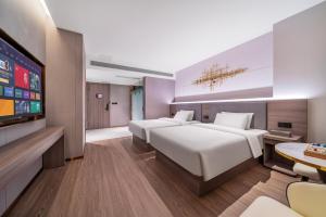 Letto o letti in una camera di ChongQing Could Hotel 重庆云禧酒店